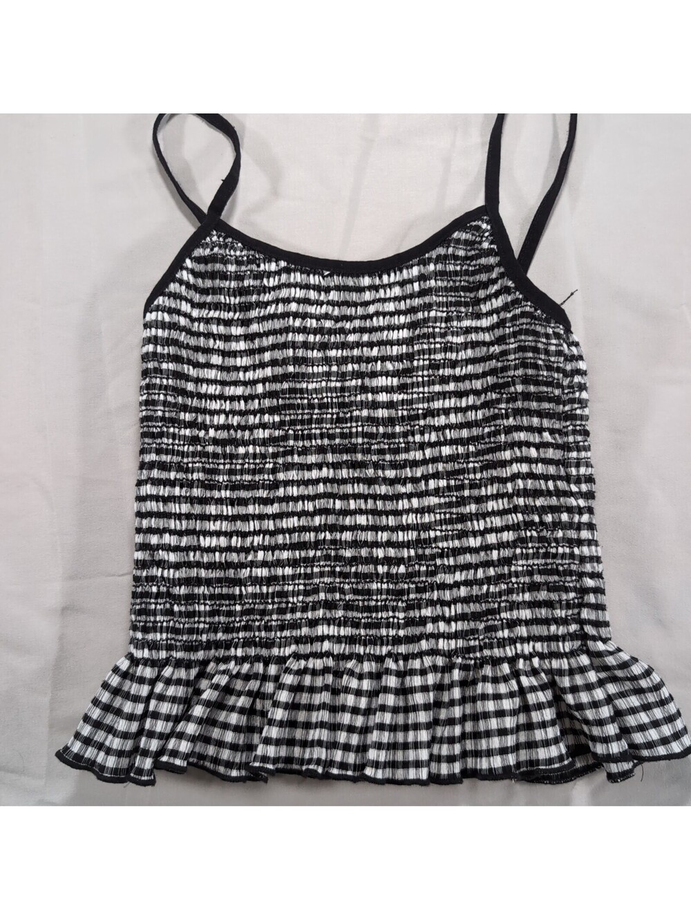 Blue Jasmine Black and White Smocked Ruffle Hem Tank Top